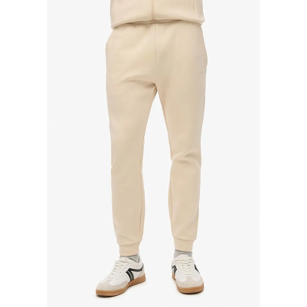 [해외]슈퍼드라이 Tech Tapered 운동복 바지 141110955 Tapioca Cream Beige